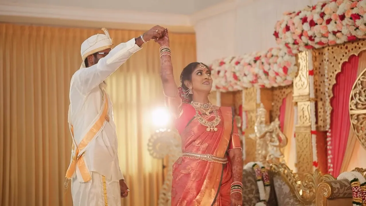 A Tamil wedding on a flower-filled wedding stage, filmed by Candid Cineframe