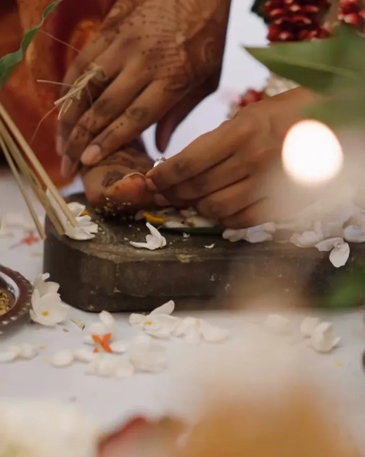 Hands at the grindstone during the ceremony