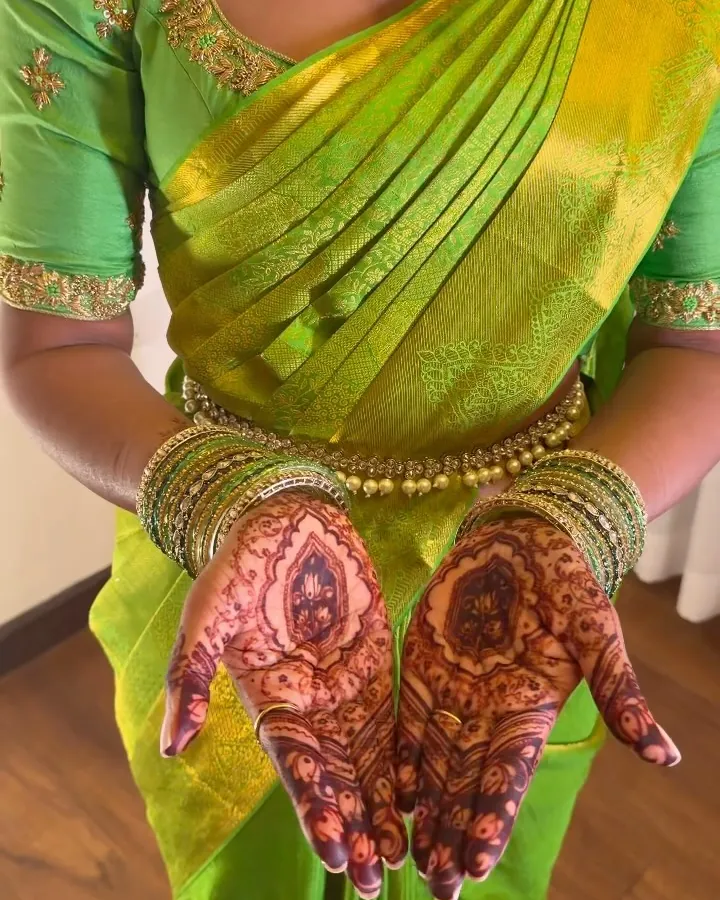 Ashwini in green silk and temple jewellery for her bridal portrait